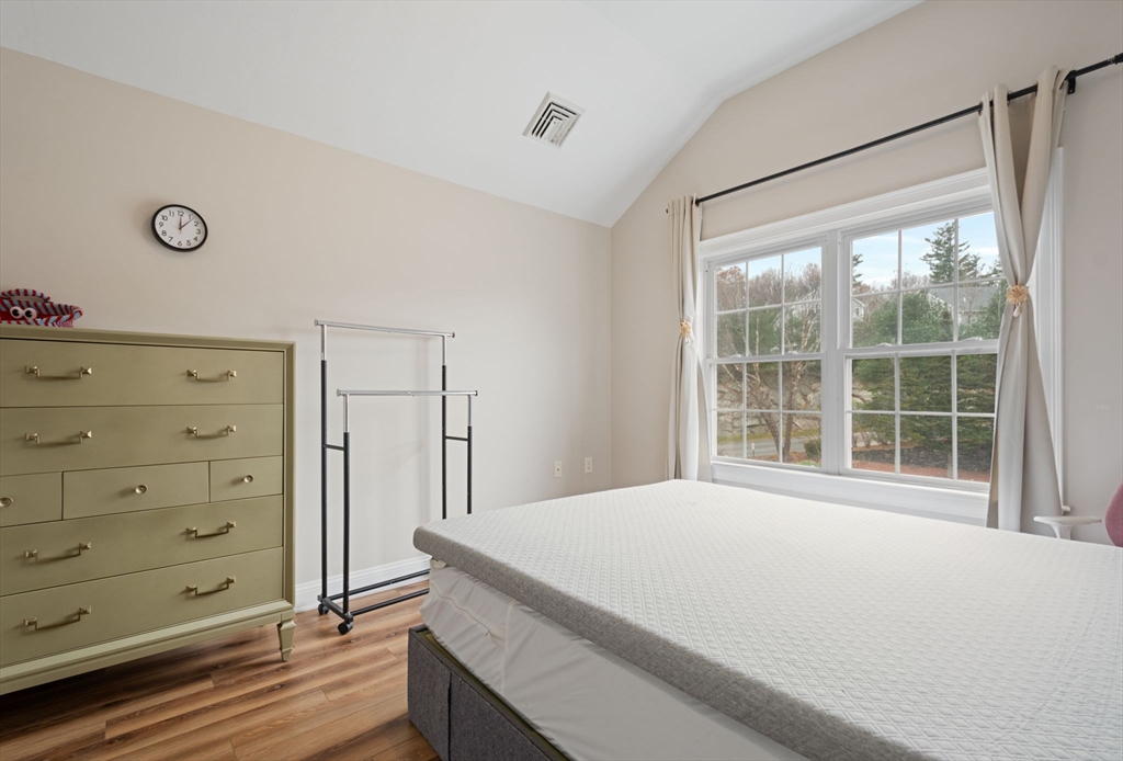 806 Ledgewood Way, Unit 806 Clinton, MA 01510 - Photo 32 of 42 a bedroom with a bed and a window