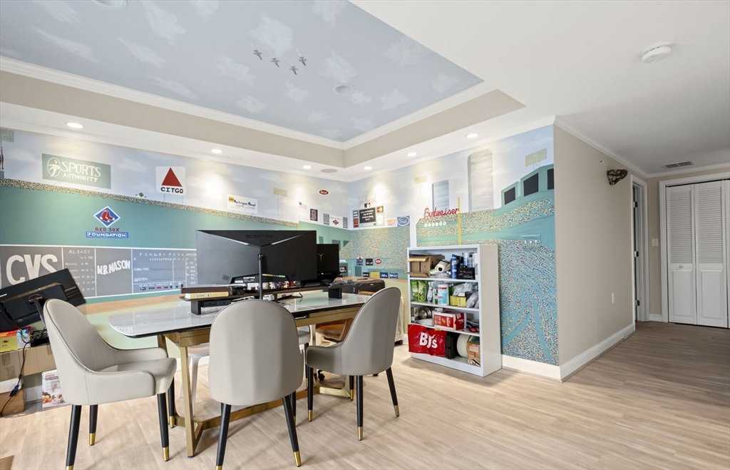 806 Ledgewood Way, Unit 806 Clinton, MA 01510 - Photo 36 of 42 a room with stainless steel appliances lots of furniture and wooden floors