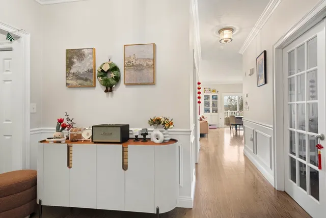 a view of living room with furniture and wooden floor