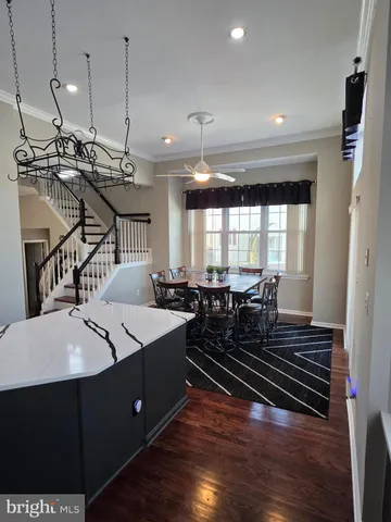 a very nice looking dining room with wooden floor