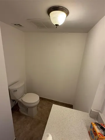 a bathroom with a toilet and a sink