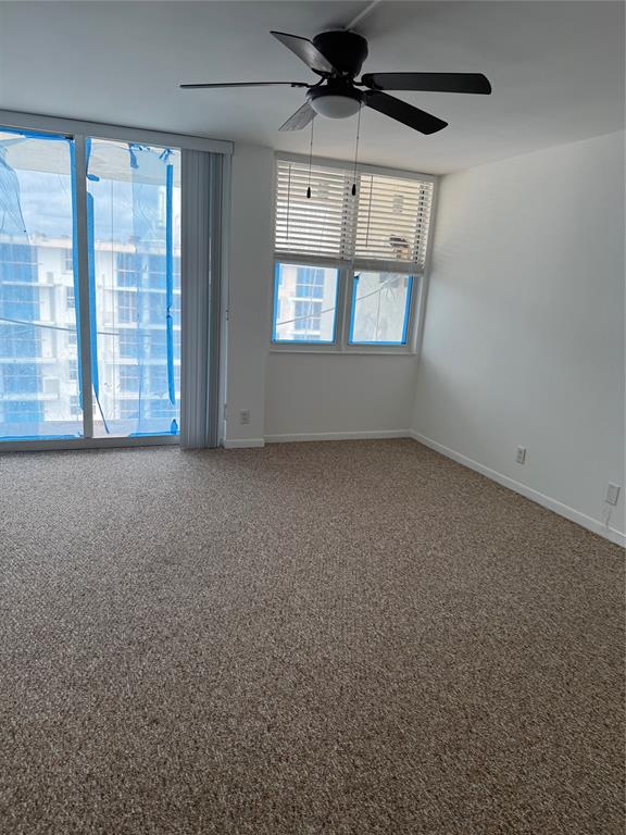 111 Briny Avenue, Unit PH17 Pompano Beach, FL 33062 - Photo 6 of 11 a view of an empty room with a window