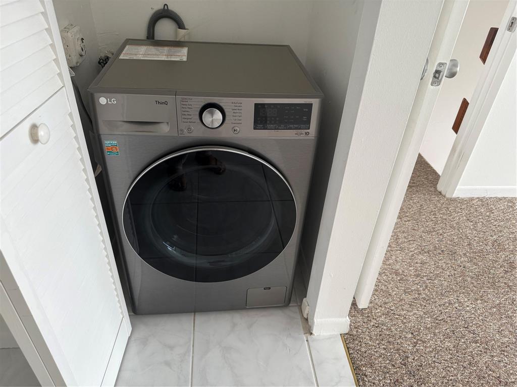 111 Briny Avenue, Unit PH17 Pompano Beach, FL 33062 - Photo 10 of 11 a view of washer and dryer in bathroom