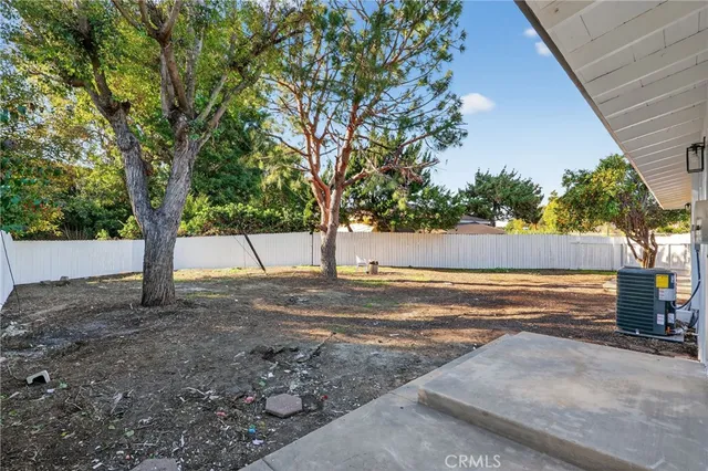 a view of a yard with large tree