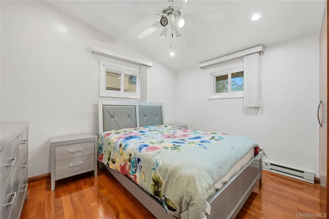 a spacious bedroom with a large bed and a large window