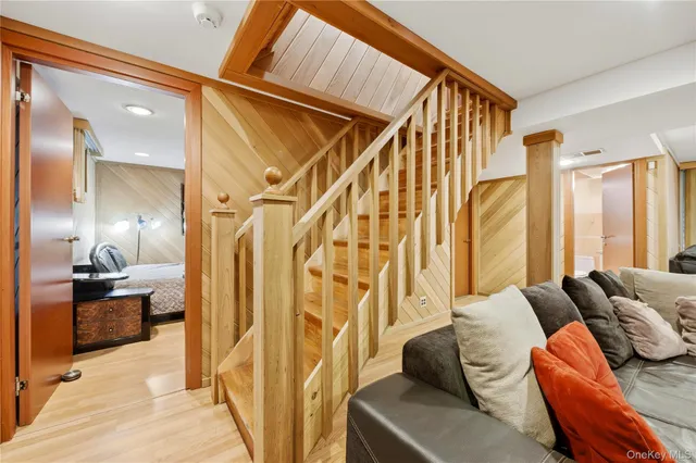 a large bed sitting in a bedroom next to a cabinet