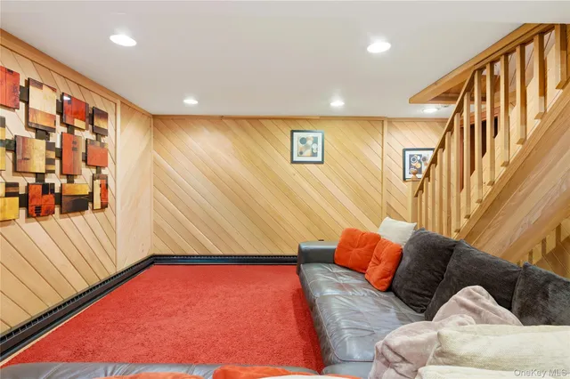a bathroom with a toilet sink vanity shower and mirror