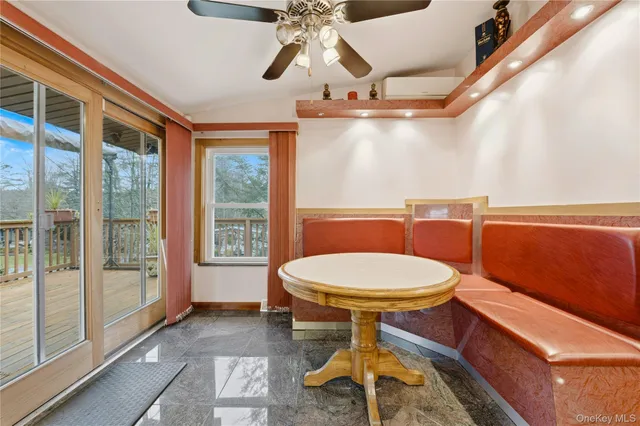 a bathroom with a toilet a sink and window