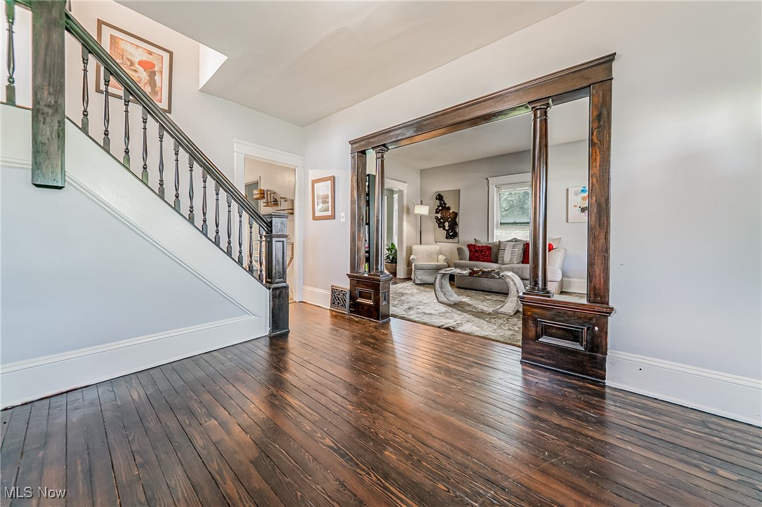 13614 Granger Road Cleveland, OH 44125 - Photo 6 of 38 Foyer entrance with wood-type flooring and stairs