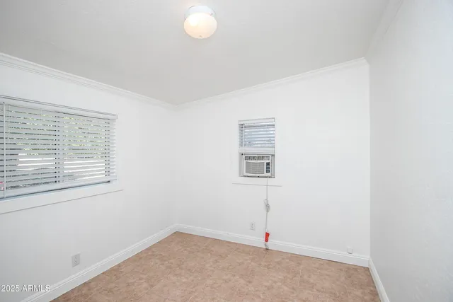 an empty room with windows