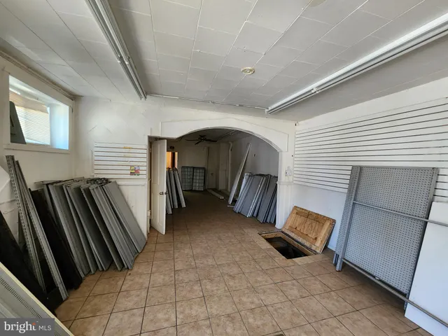 a view of an empty room and wooden floor