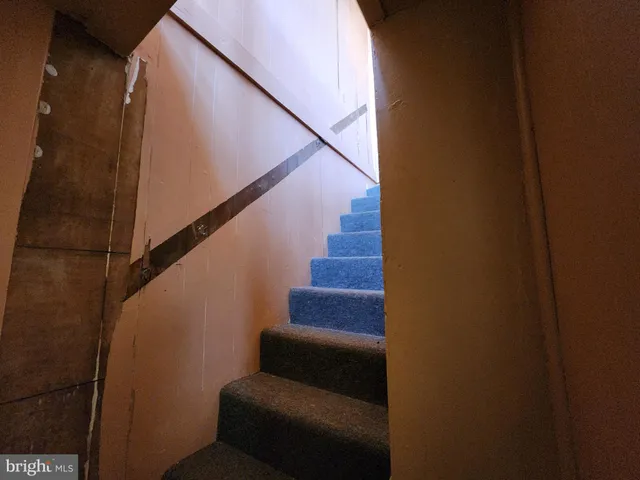 a kitchen with a stove sink and cabinets