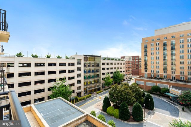 a view of a chairs and table in a balcony
