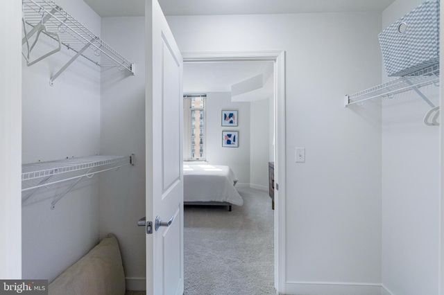 a bedroom with bed and window