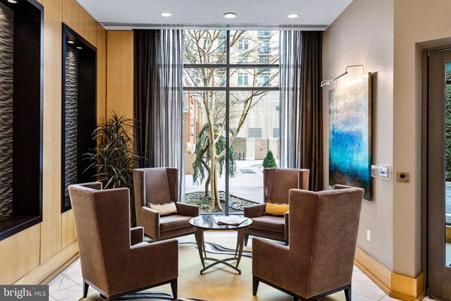 a view of a livingroom with furniture and a window