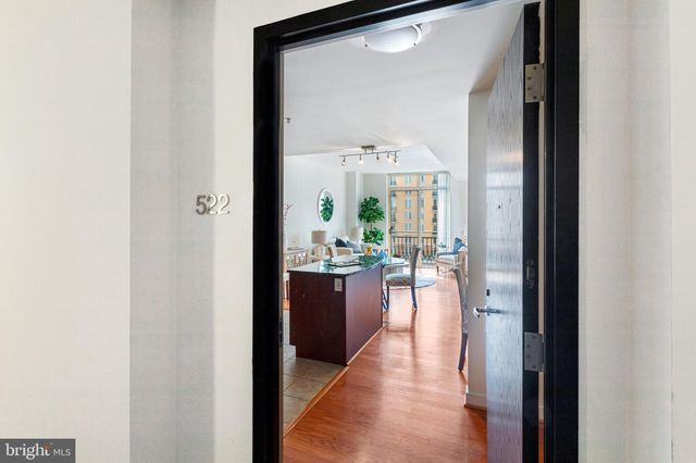 a en suite bathroom with a granite countertop sink and a mirror