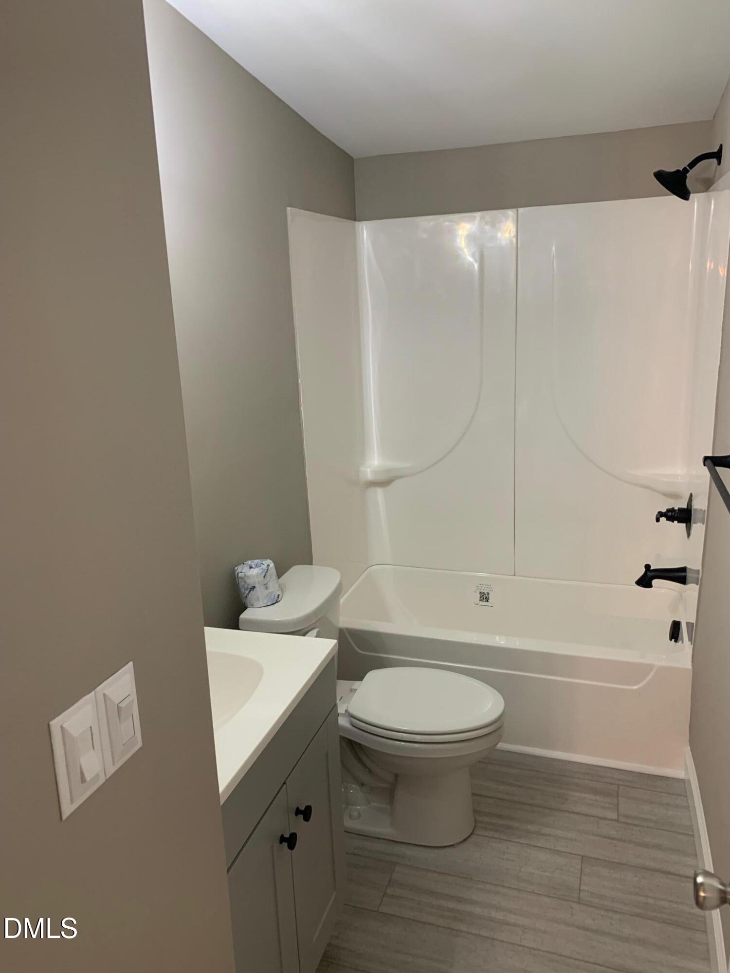 204 Deep Woods Trail Roxboro, NC 27574 - Photo 21 of 28 a bathroom with a sink a toilet and shower