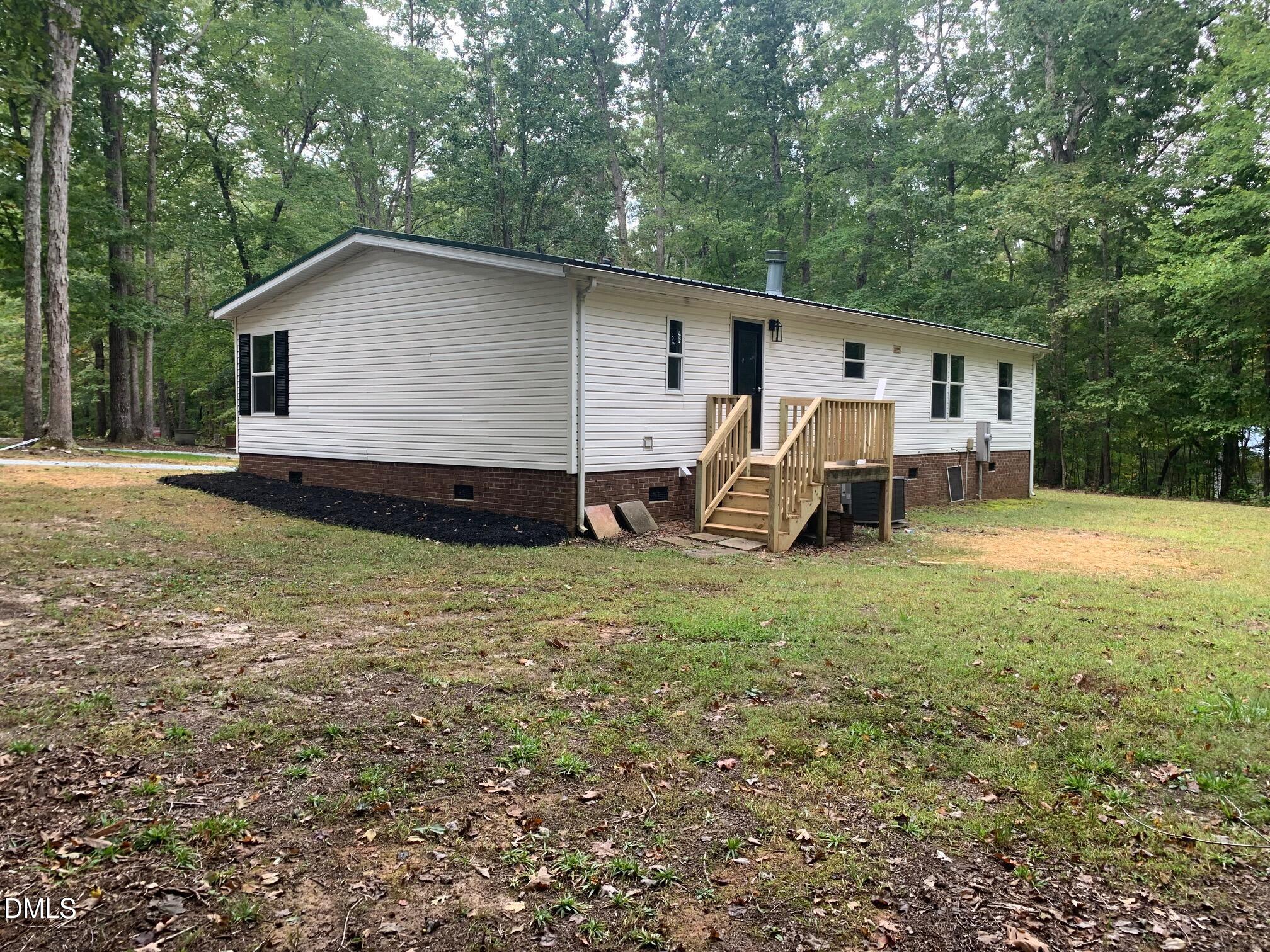 204 Deep Woods Trail Roxboro, NC 27574 - Photo 3 of 28 a view of a house with backyard
