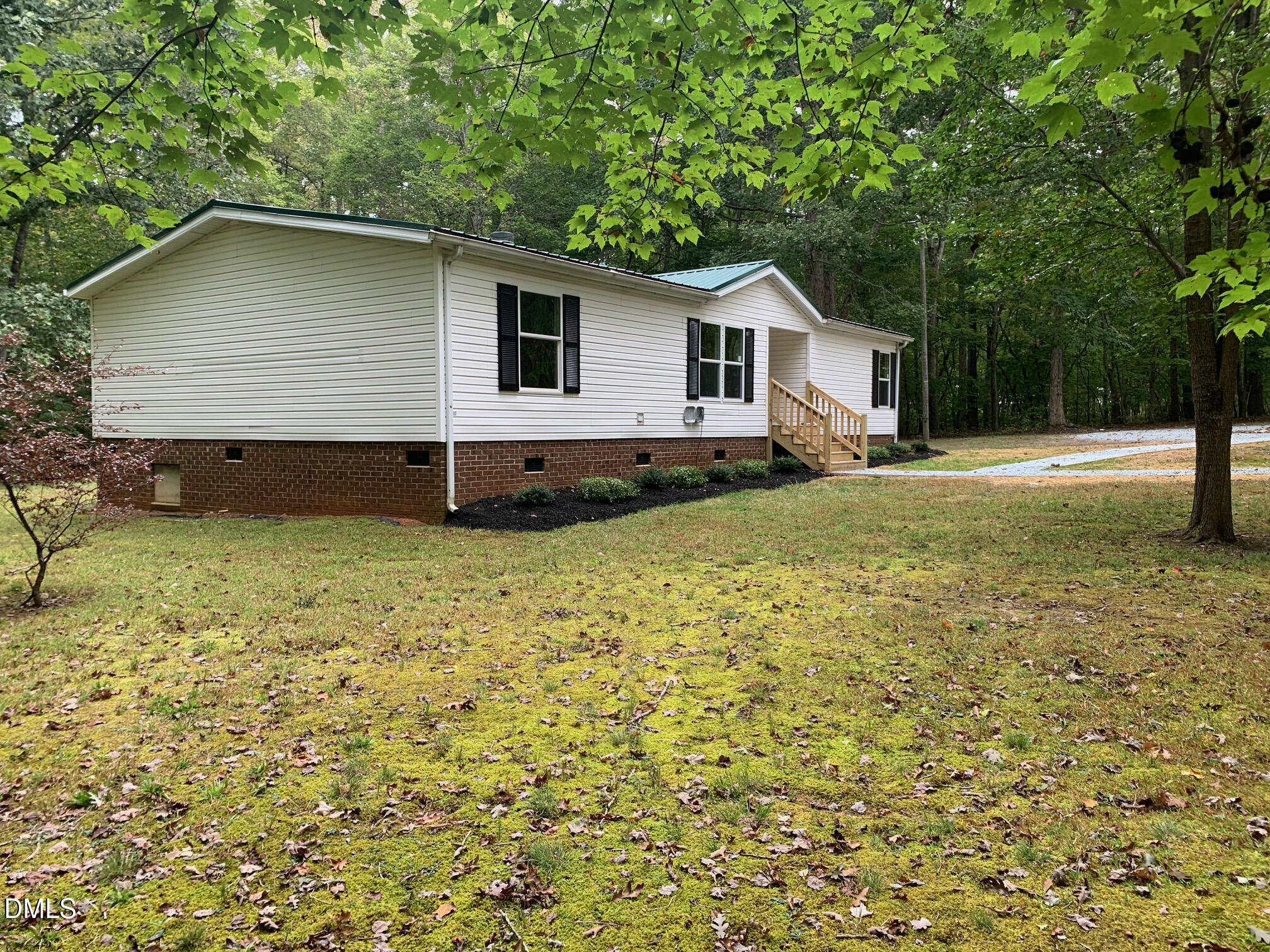 204 Deep Woods Trail Roxboro, NC 27574 - Photo 7 of 28 a house view with a backyard space