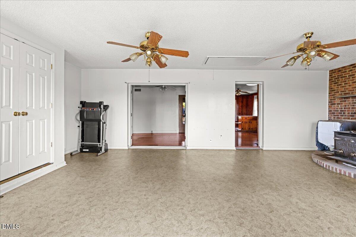109 Little Ponderosa Road Macon, NC 27551 - Photo 5 of 32 a view of empty room with a ceiling fan