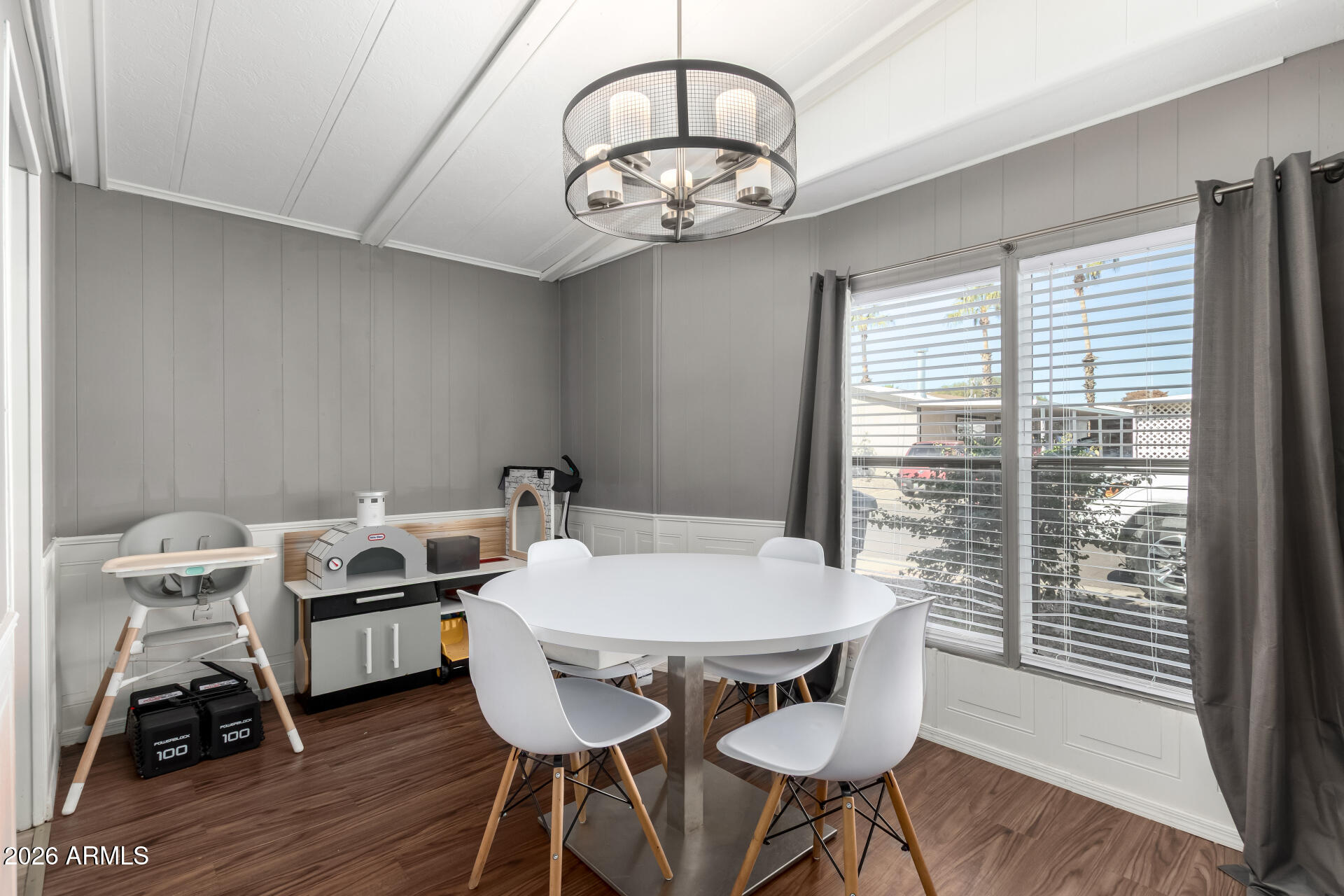 245 South 56th Street, Unit 64 Mesa, AZ 85206 - Photo 12 of 35 a view of a dining room with furniture window and wooden floor