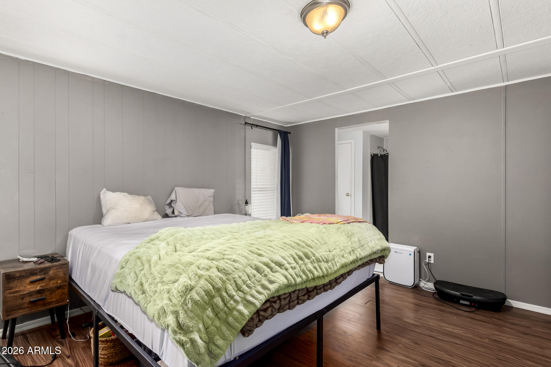 245 South 56th Street, Unit 64 Mesa, AZ 85206 - Photo 16 of 35 a bedroom with a bed and a window