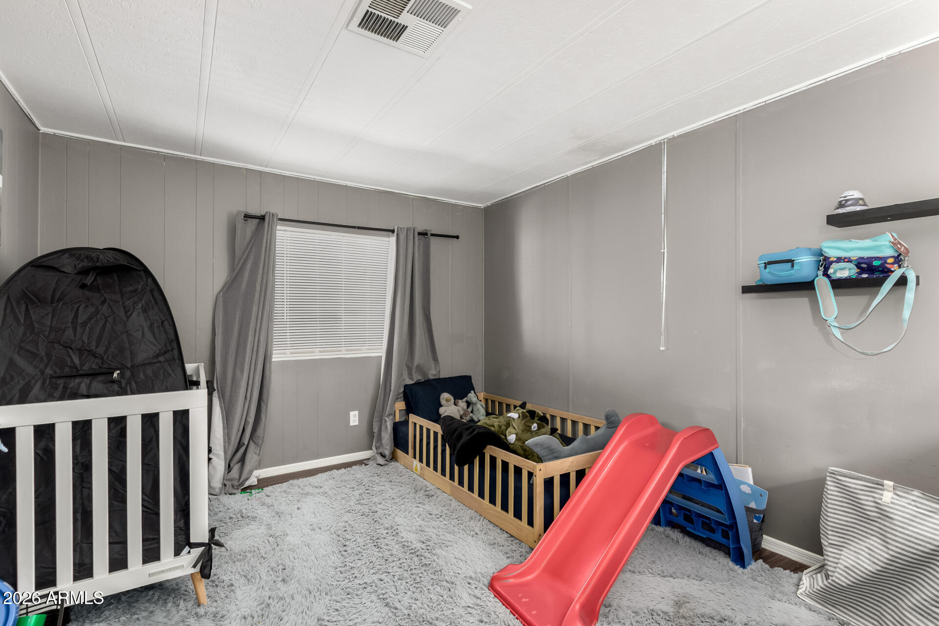 245 South 56th Street, Unit 64 Mesa, AZ 85206 - Photo 19 of 35 a bedroom with furniture and a window