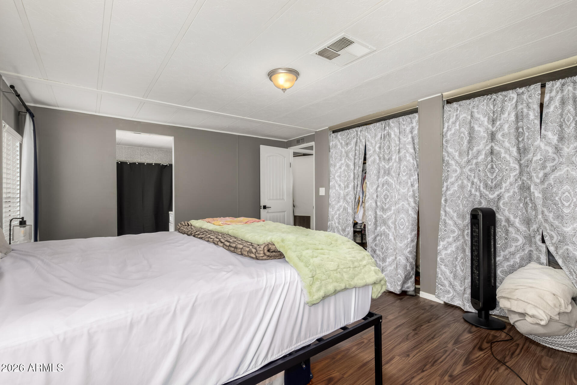 245 South 56th Street, Unit 64 Mesa, AZ 85206 - Photo 19 of 34 a bedroom with a bed and a window