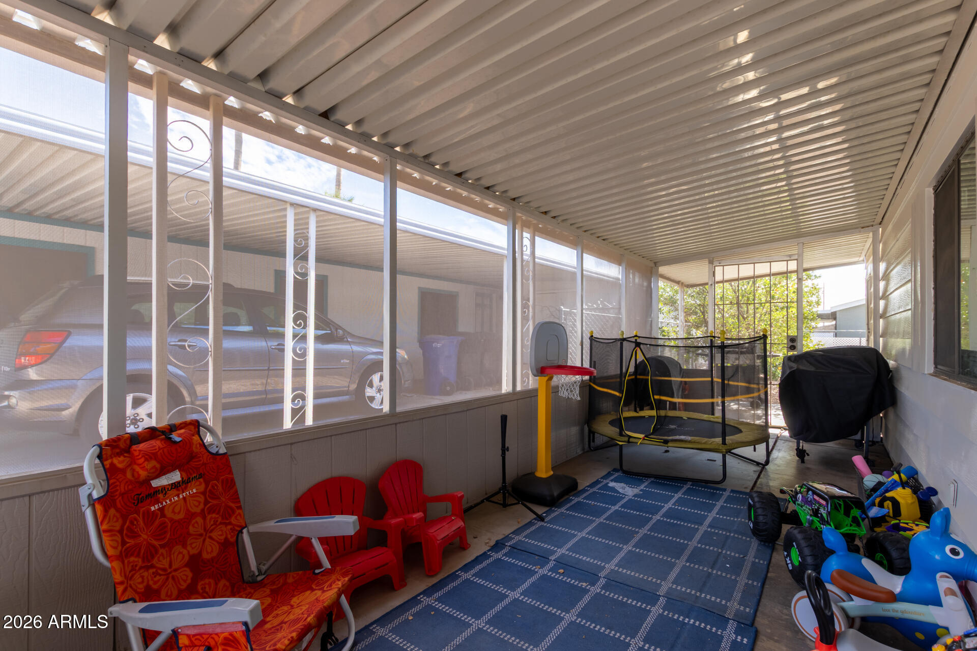 245 South 56th Street, Unit 64 Mesa, AZ 85206 - Photo 24 of 35 a room with gym equipment and windows