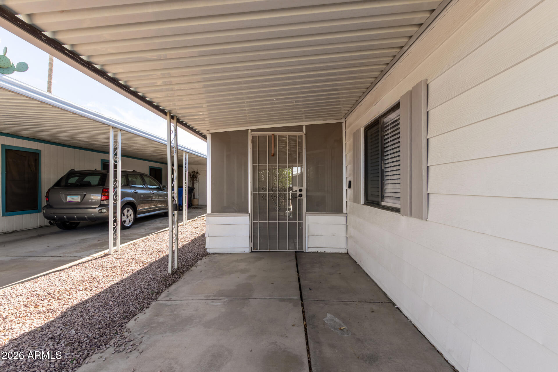 245 South 56th Street, Unit 64 Mesa, AZ 85206 - Photo 25 of 34 a view of a porch