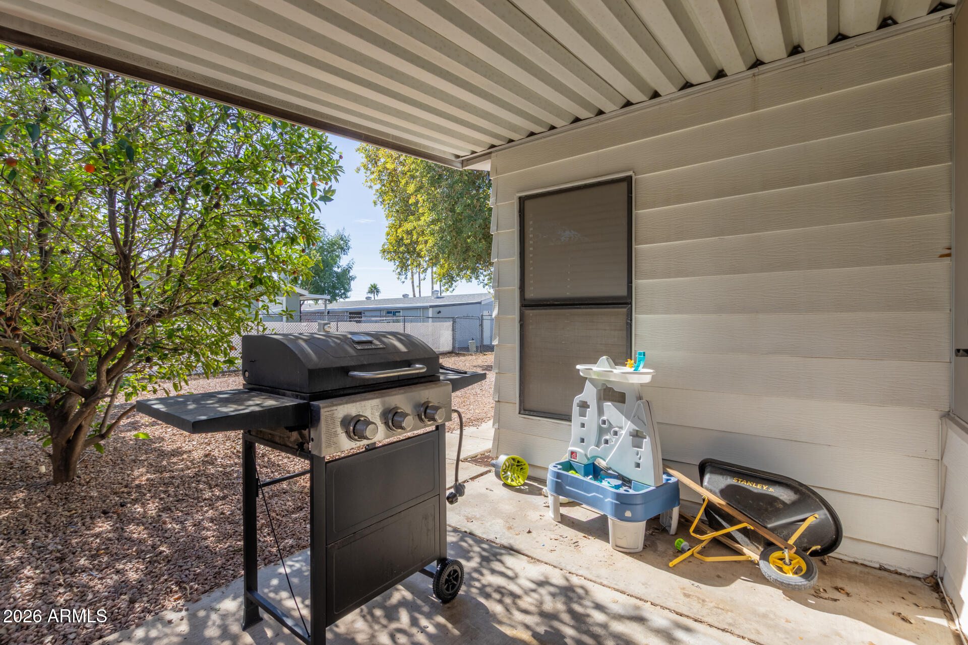 245 South 56th Street, Unit 64 Mesa, AZ 85206 - Photo 27 of 34 a backyard of a house with seating space