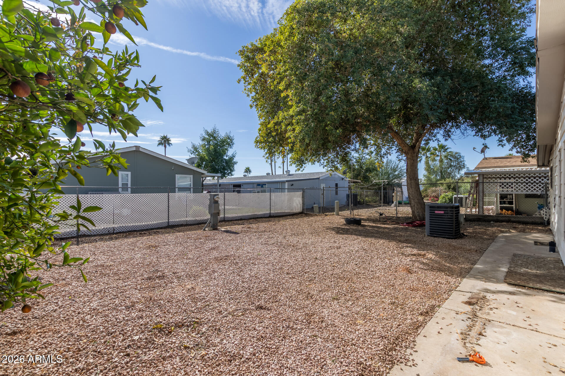 245 South 56th Street, Unit 64 Mesa, AZ 85206 - Photo 28 of 34 a view of a house with a yard and tree s