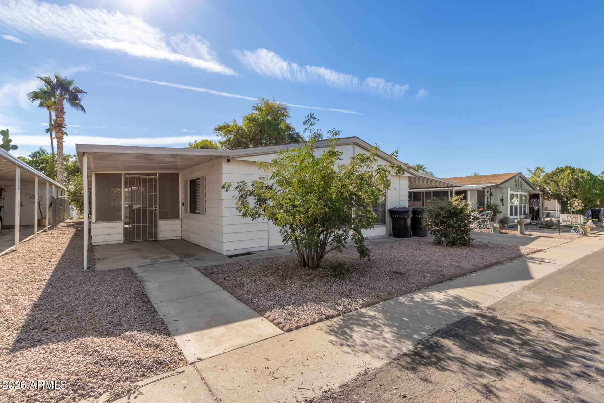 245 South 56th Street, Unit 64 Mesa, AZ 85206 - Photo 3 of 35 a view of a house with a patio
