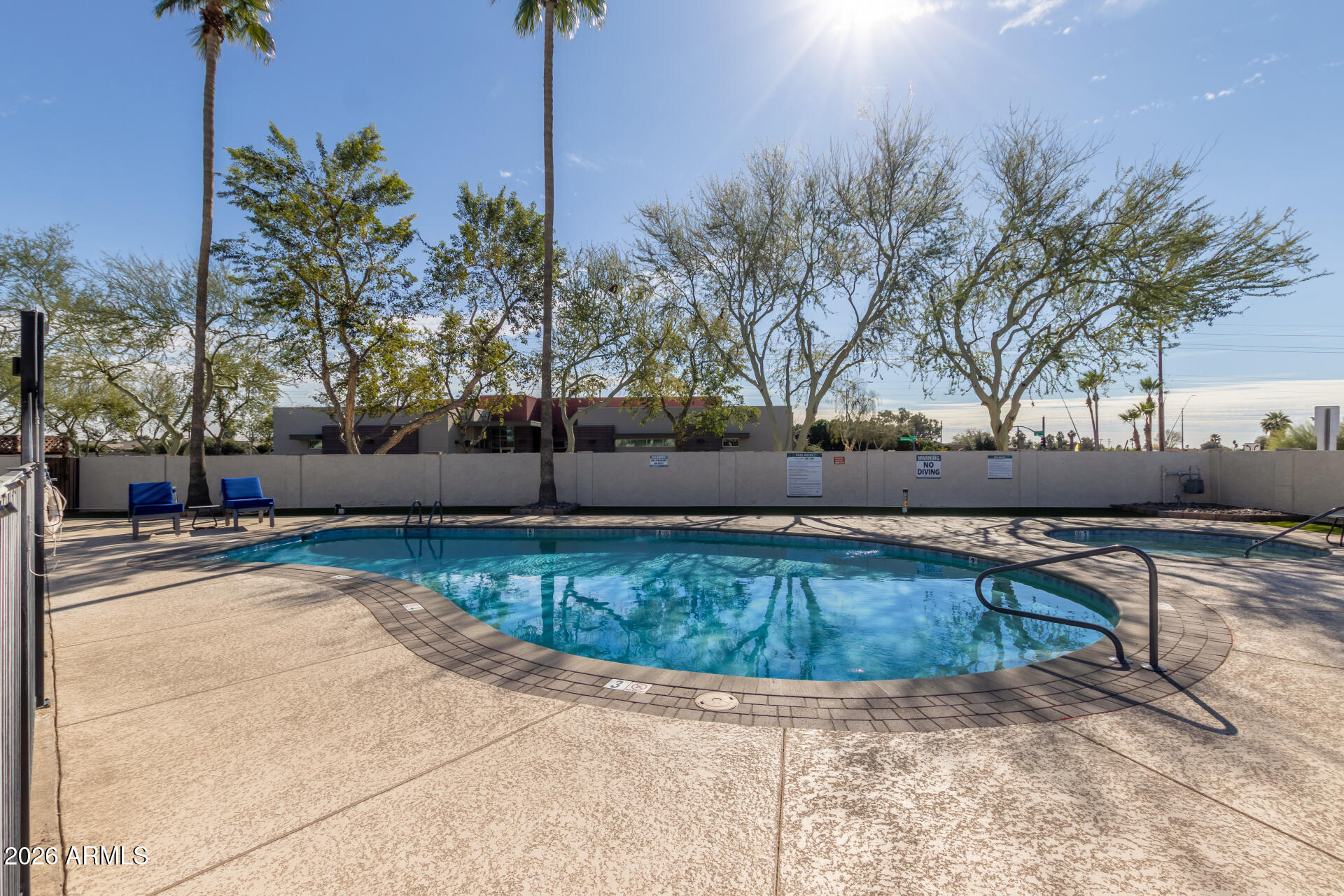 245 South 56th Street, Unit 64 Mesa, AZ 85206 - Photo 4 of 34 a view of a swimming pool with a patio