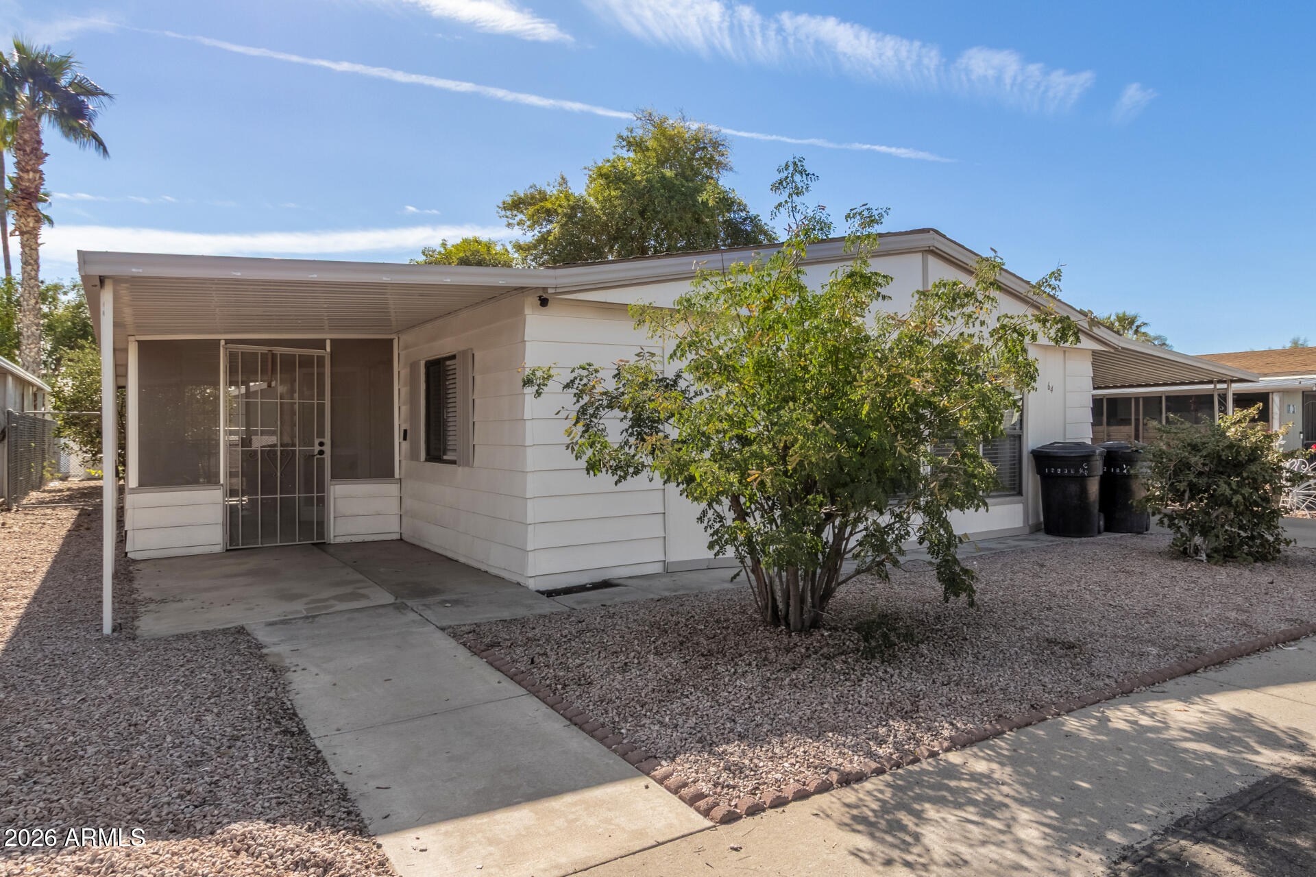245 South 56th Street, Unit 64 Mesa, AZ 85206 - Photo 4 of 35 a view of a house with potted plants