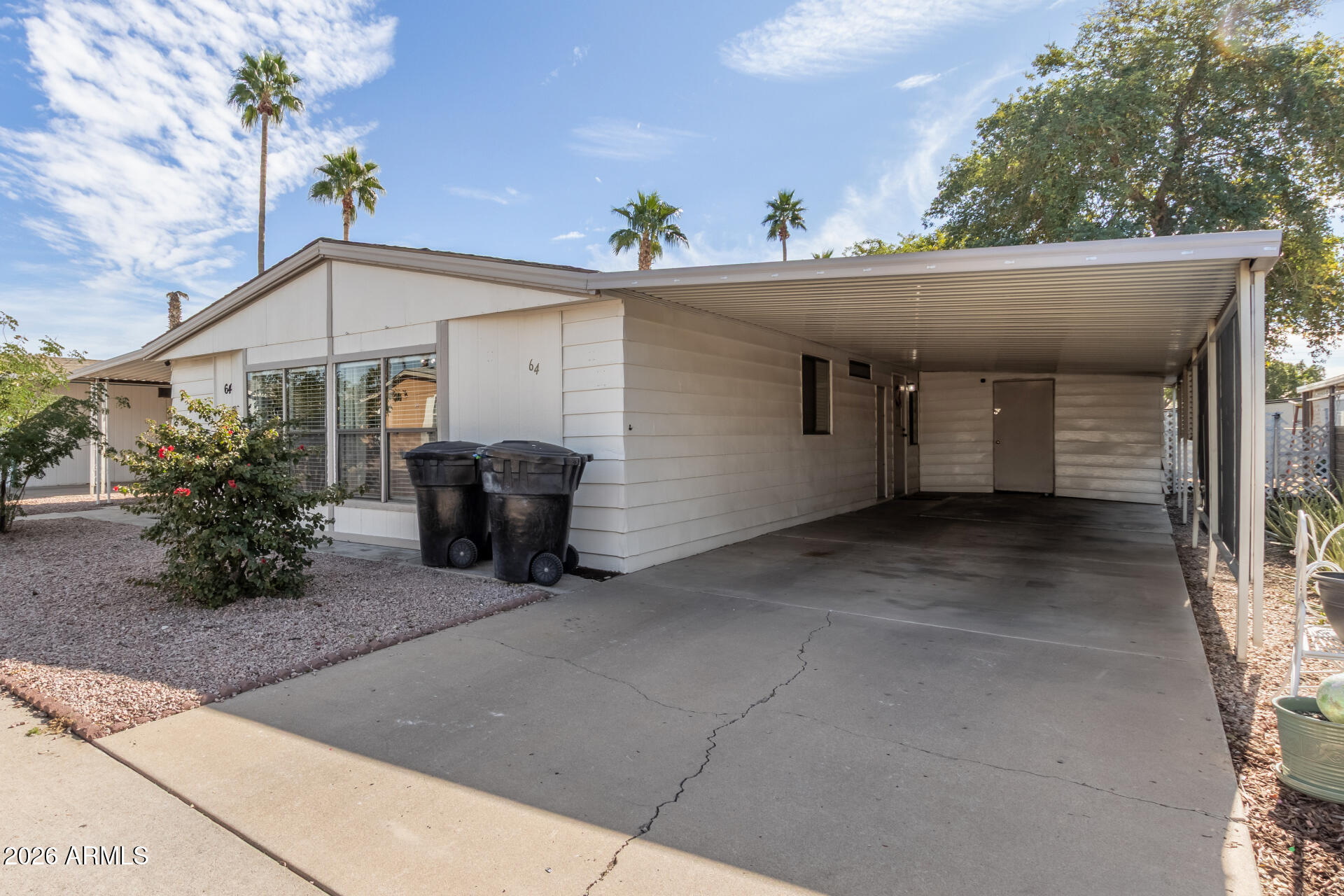 245 South 56th Street, Unit 64 Mesa, AZ 85206 - Photo 6 of 35 a view of a house with a window and potted plants