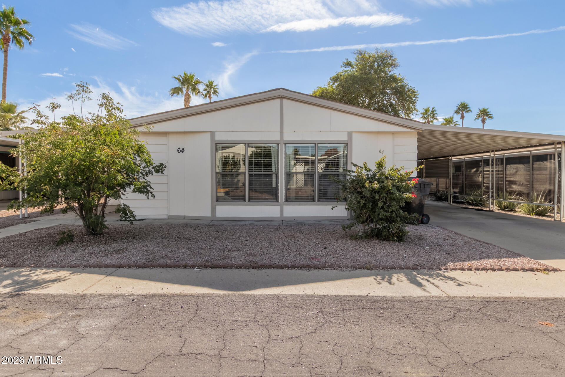 245 South 56th Street, Unit 64 Mesa, AZ 85206 - Photo 7 of 34 a view of a house with backyard and sitting area