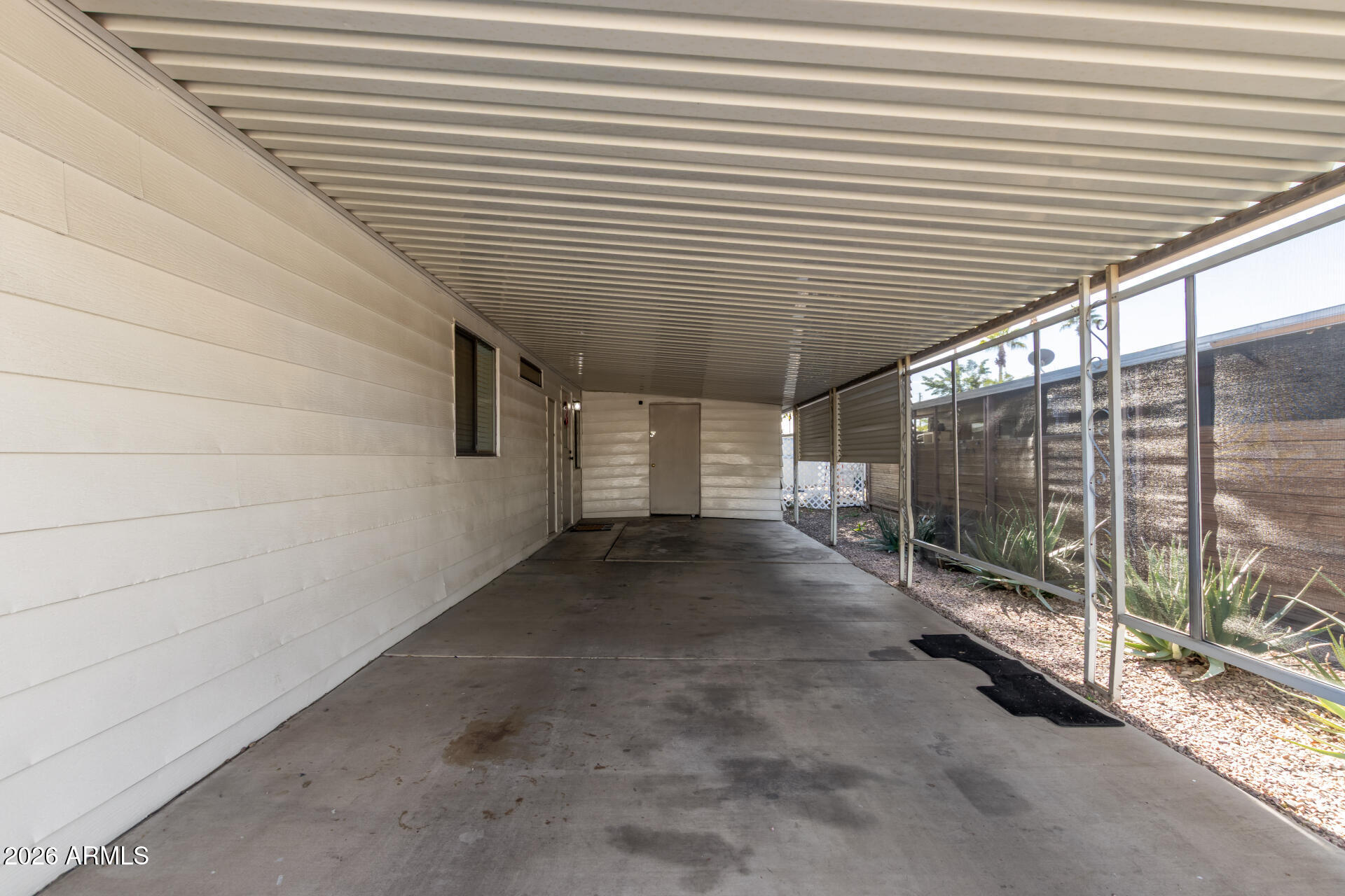 245 South 56th Street, Unit 64 Mesa, AZ 85206 - Photo 8 of 35 a view of a backyard with floor to ceiling window
