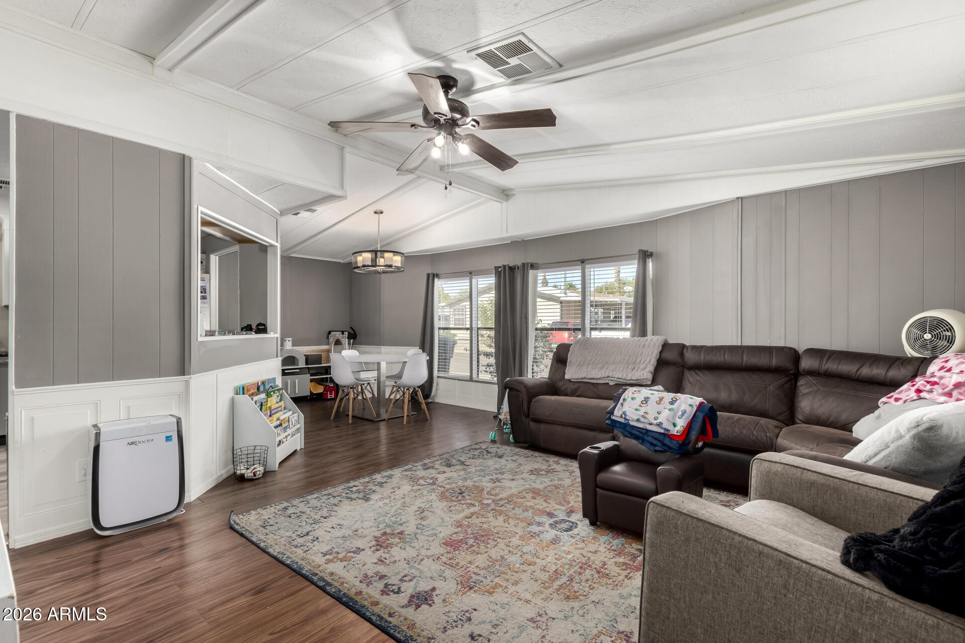 245 South 56th Street, Unit 64 Mesa, AZ 85206 - Photo 9 of 35 a living room with furniture and a wooden floor