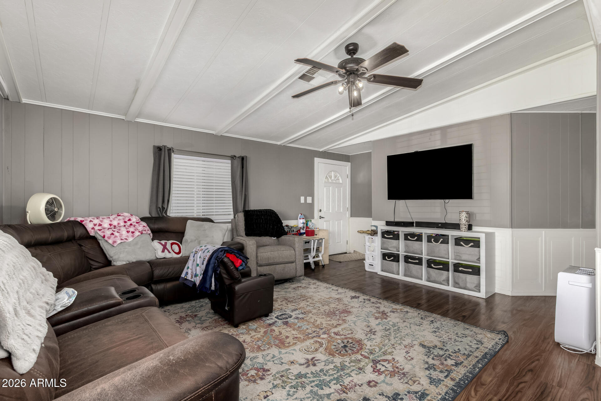 245 South 56th Street, Unit 64 Mesa, AZ 85206 - Photo 10 of 35 a living room with furniture and a flat screen tv