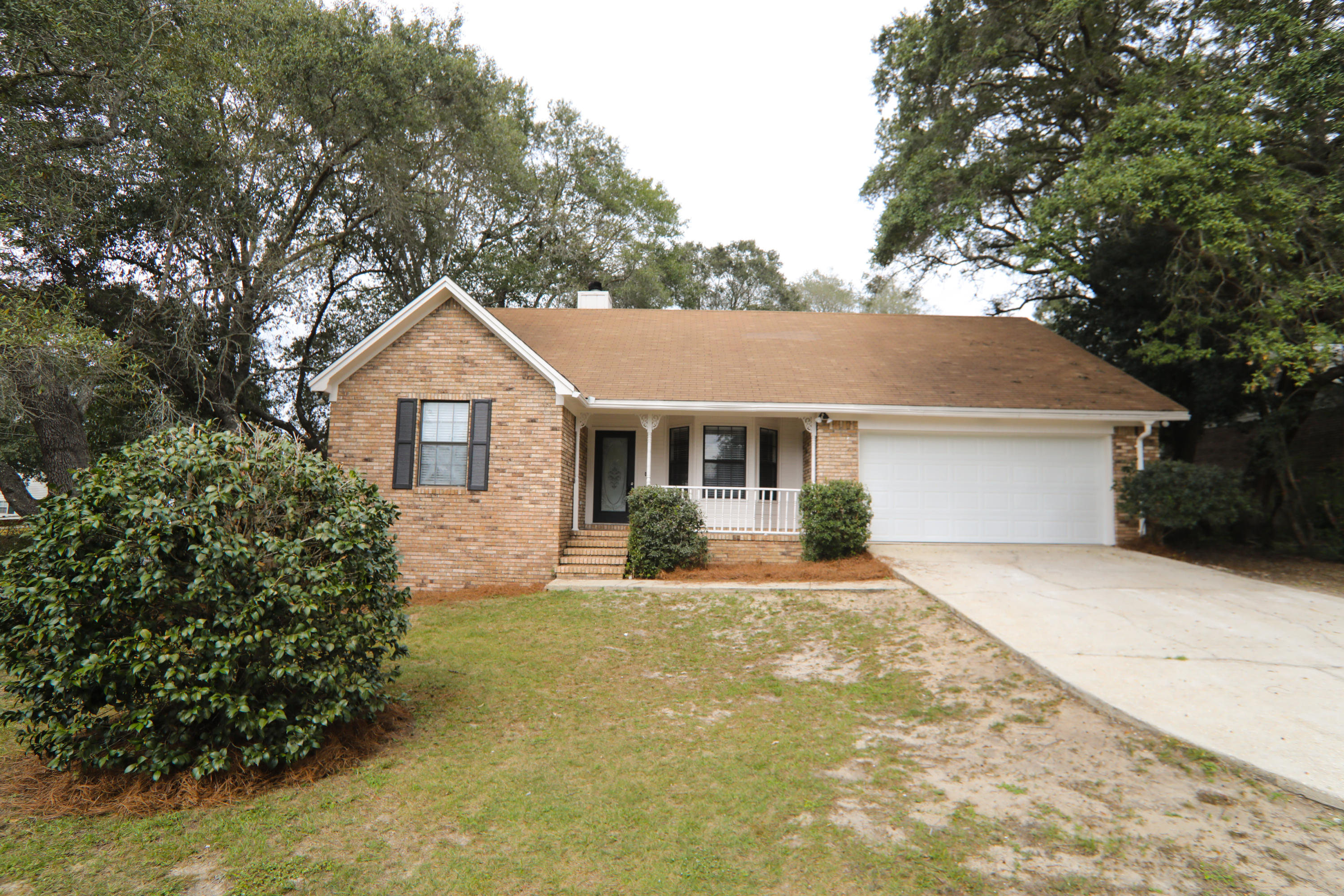 102 Brian Drive Crestview, FL 32536 - Photo 14 of 21 a front view of a house with a yard and garage