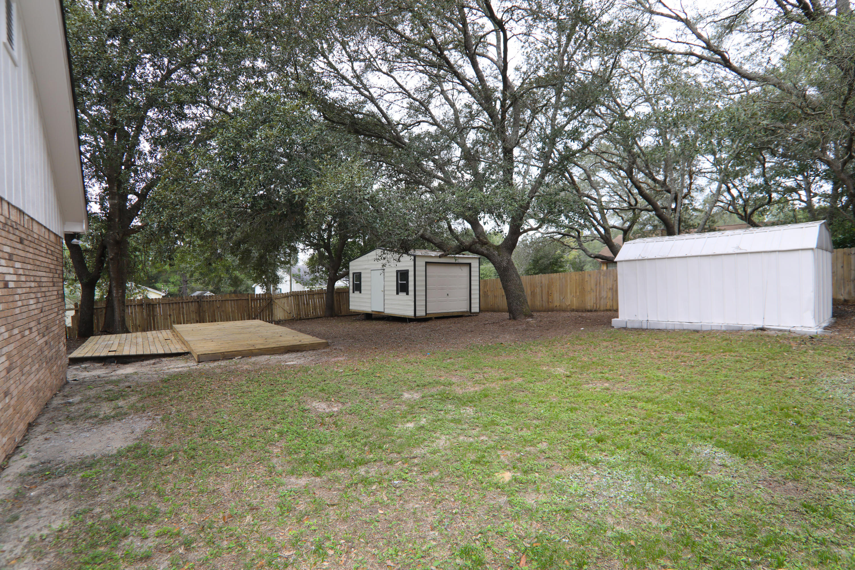 102 Brian Drive Crestview, FL 32536 - Photo 19 of 21 a white house that has a tree in front of it
