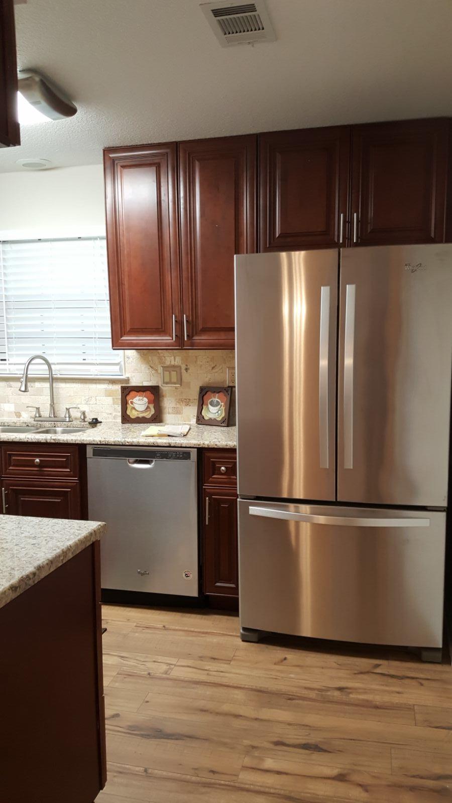 102 Brian Drive Crestview, FL 32536 - Photo 5 of 21 a kitchen with a refrigerator and a sink