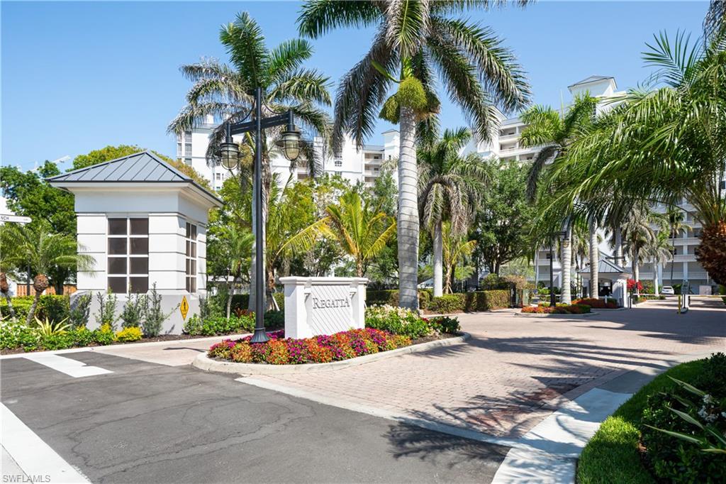 460 Launch Circle, Unit PH1 Naples, FL 34108 - Photo 18 of 28 a street sign on a sidewalk next to a road