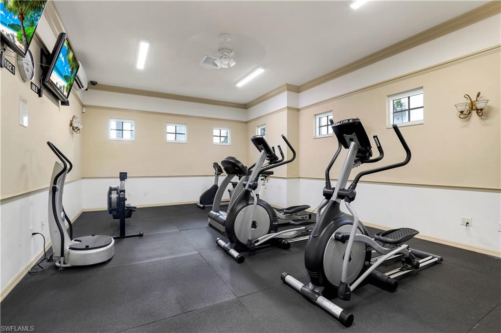 460 Launch Circle, Unit PH1 Naples, FL 34108 - Photo 22 of 28 a view of a room with gym equipment