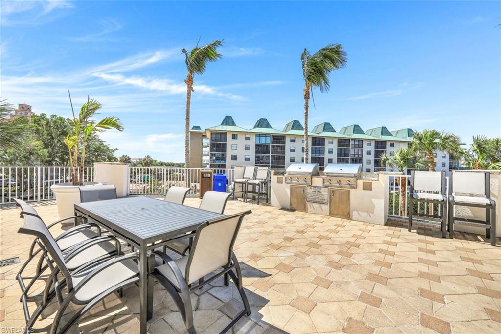 460 Launch Circle, Unit PH1 Naples, FL 34108 - Photo 24 of 28 a view of a terrace with furniture