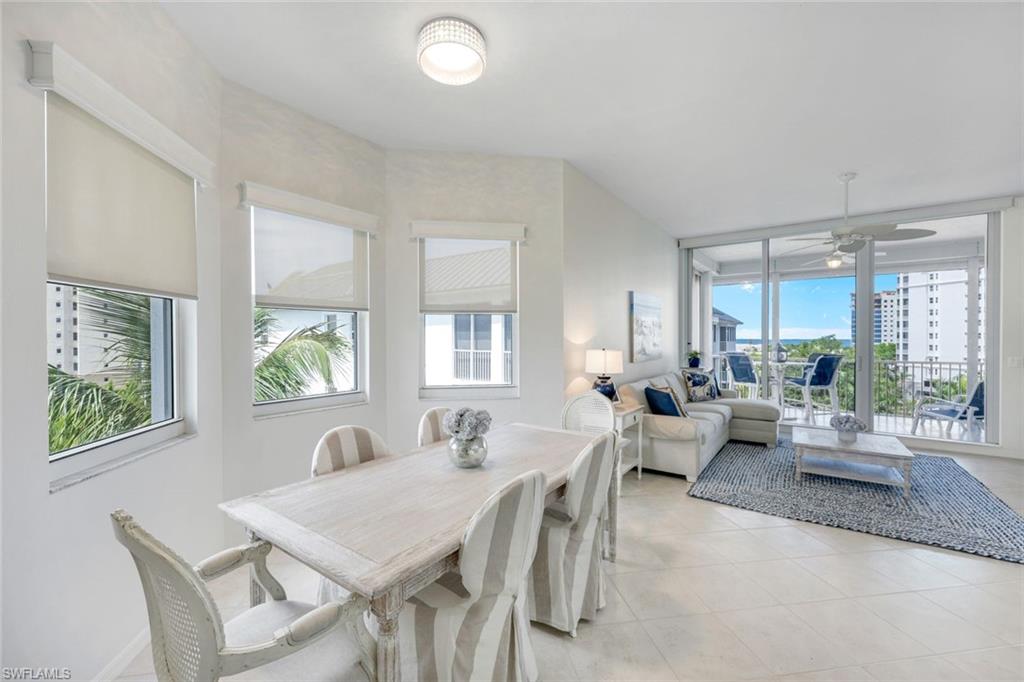 460 Launch Circle, Unit PH1 Naples, FL 34108 - Photo 8 of 28 a view of a dining room and livingroom with furniture