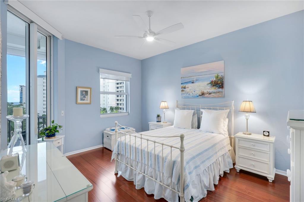 460 Launch Circle, Unit PH1 Naples, FL 34108 - Photo 9 of 28 a bedroom with a bed and a painting on the wall