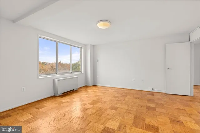 a view of an empty room with a window