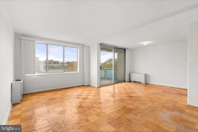 a view of an empty room with a window